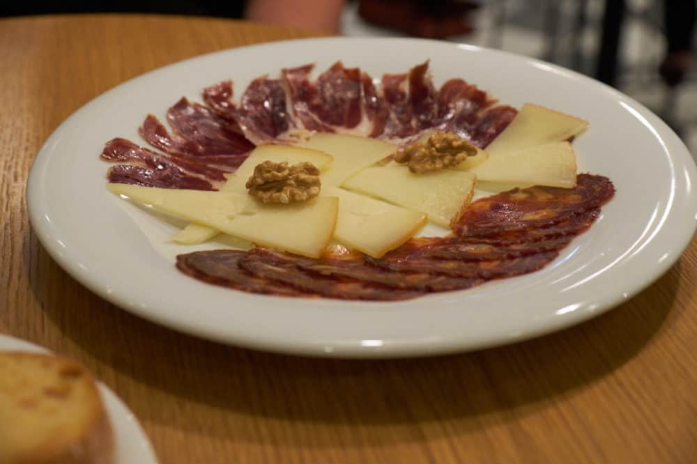 A plate of Spanish cheese and charcuterie.