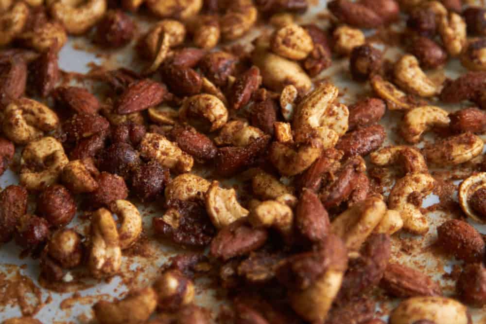 Spiced nuts on parchment paper.