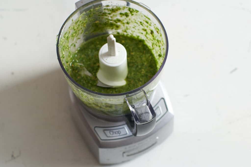 A small food processor with chile lime cilantro sauce.
