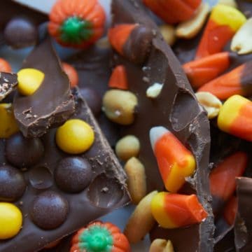 Chocolate bark topped with candy corn, peanuts, and Reeses pieces.