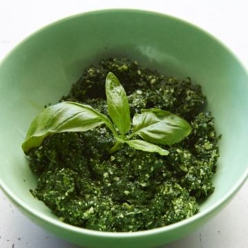 Kale pesto in a green bowl.