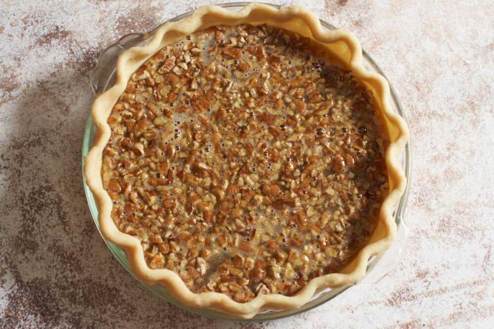 A filled pie crust ready to bake.