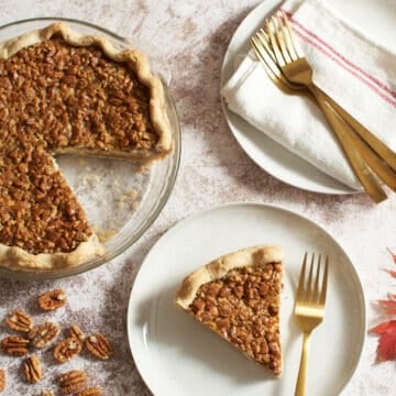 Close up of a whole pecan cream cheese pie