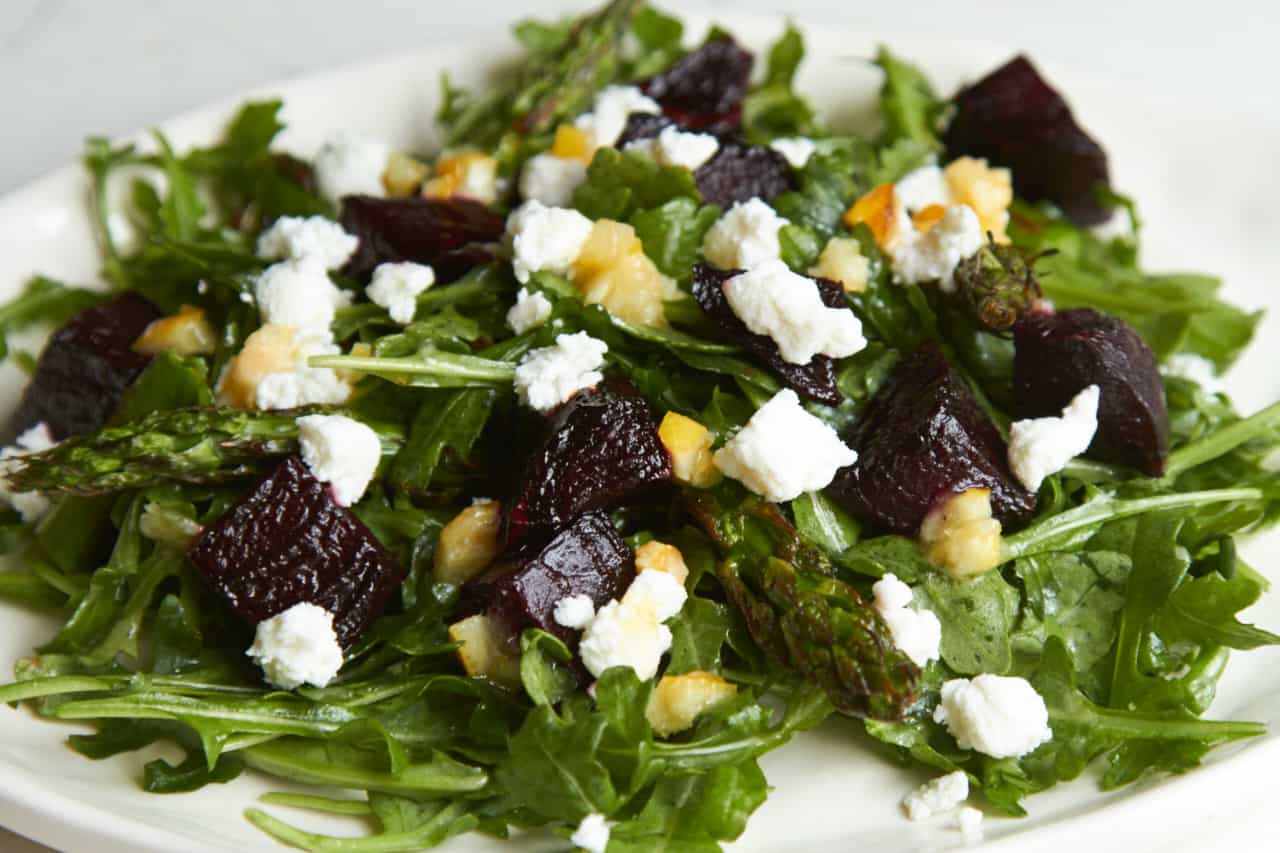 Roasted vegetable salad with charred lemon vinaigrette includes grilled beets and asparagus, and goat cheese.