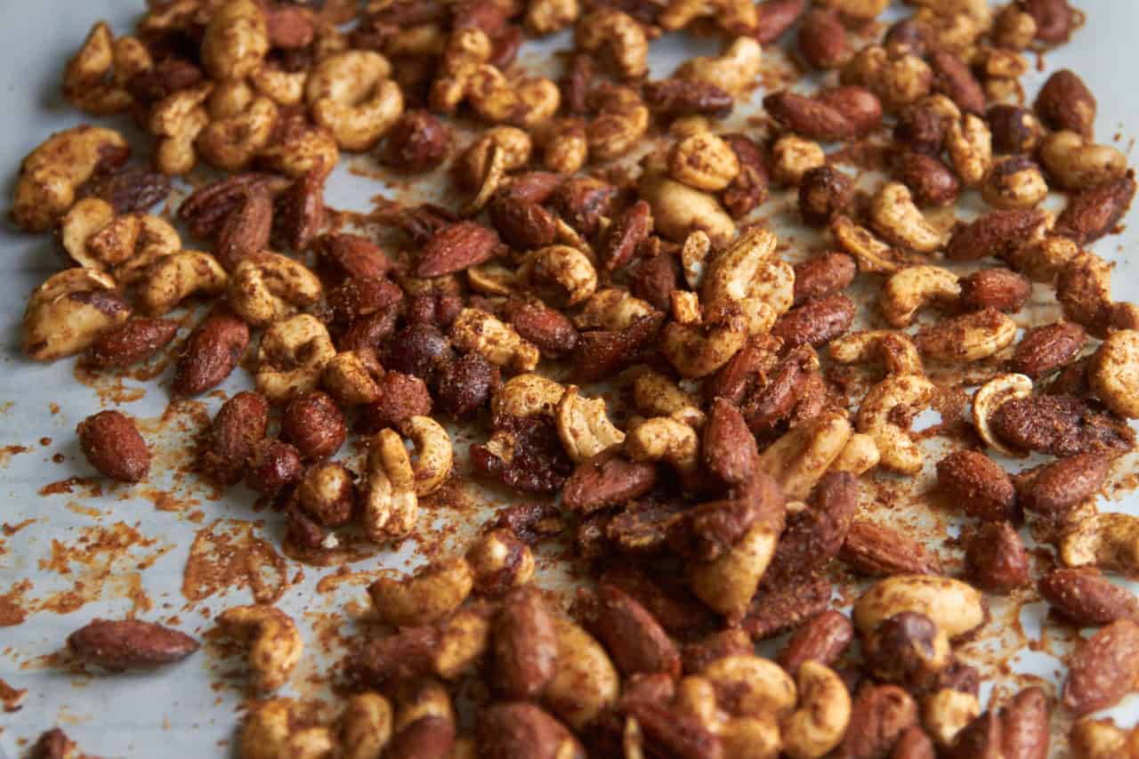 Spiced nuts on parchment paper.
