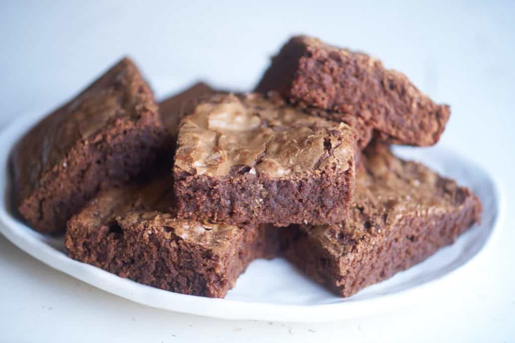 A plate of gooey dark chocolate brownies.