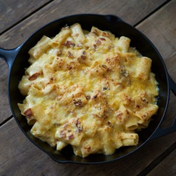 Creamy baked rigatoni in a cast iron skillet.