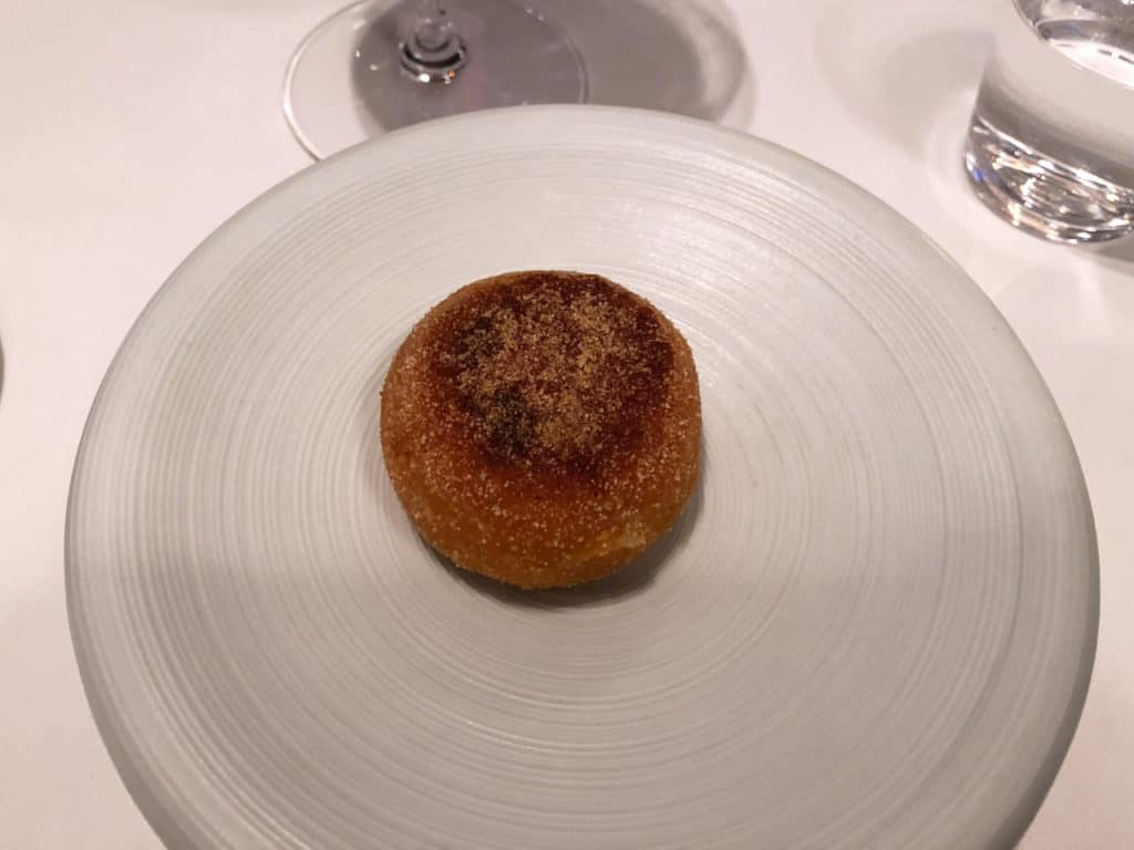 "Thomas's English Muffin" - a tomato English muffin on a white plate.