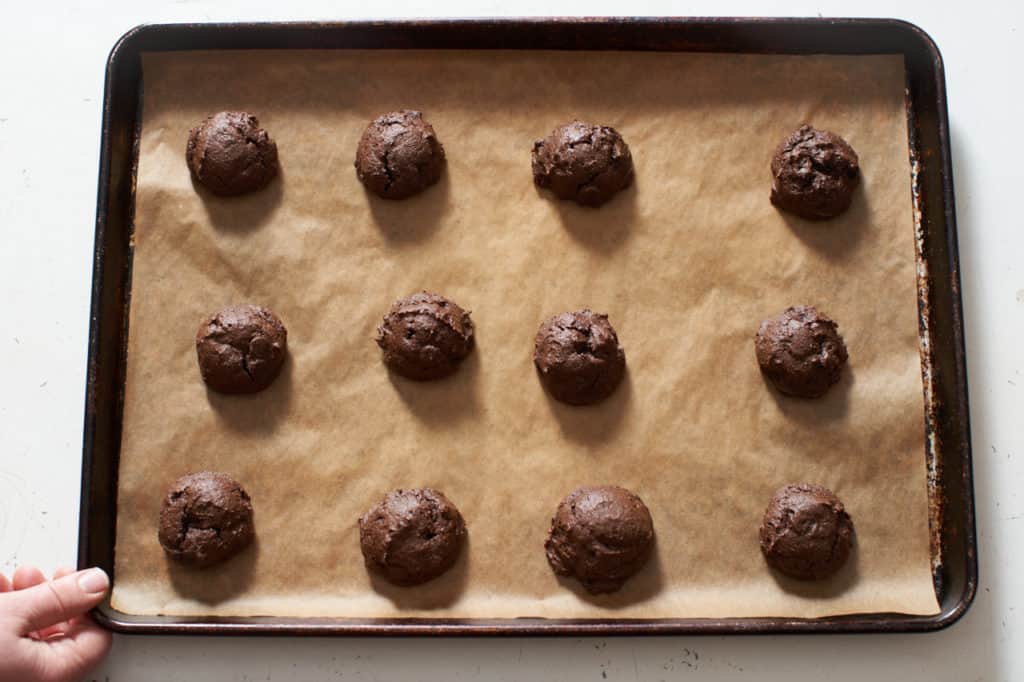 Gluten free triple chocolate cookies on a baking sheet.