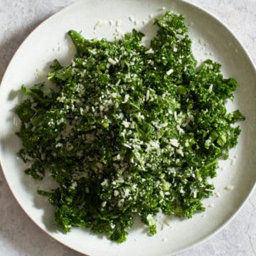 kale salad on a white plate