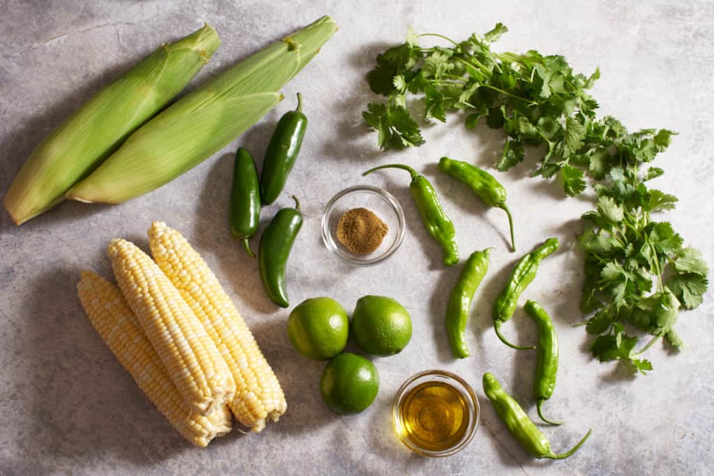 Fresh corn, jalapeños, shishito peppers, cilantro, limes, olive oil and cumin.