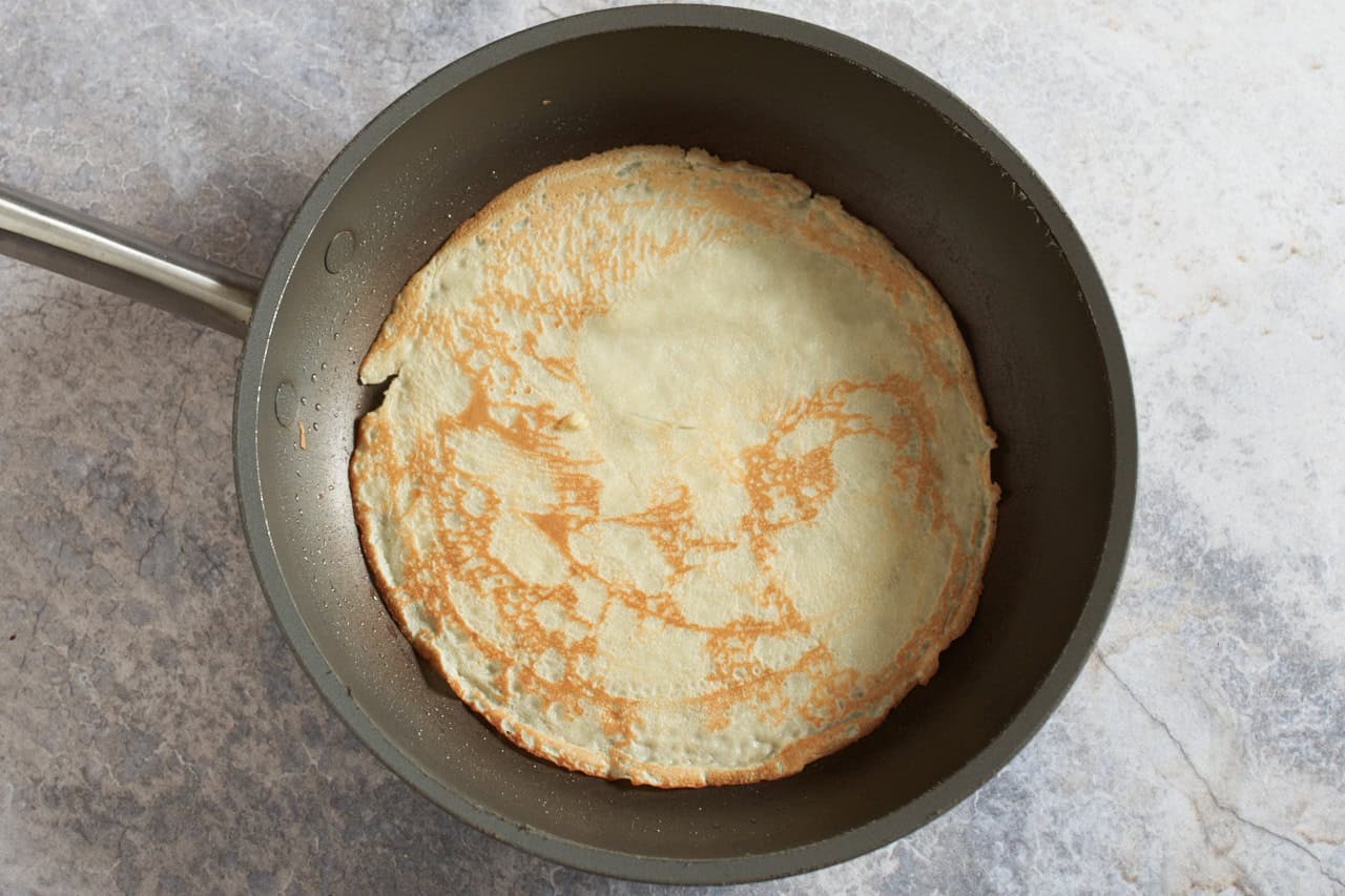 A crepe in a non-stick skillet.