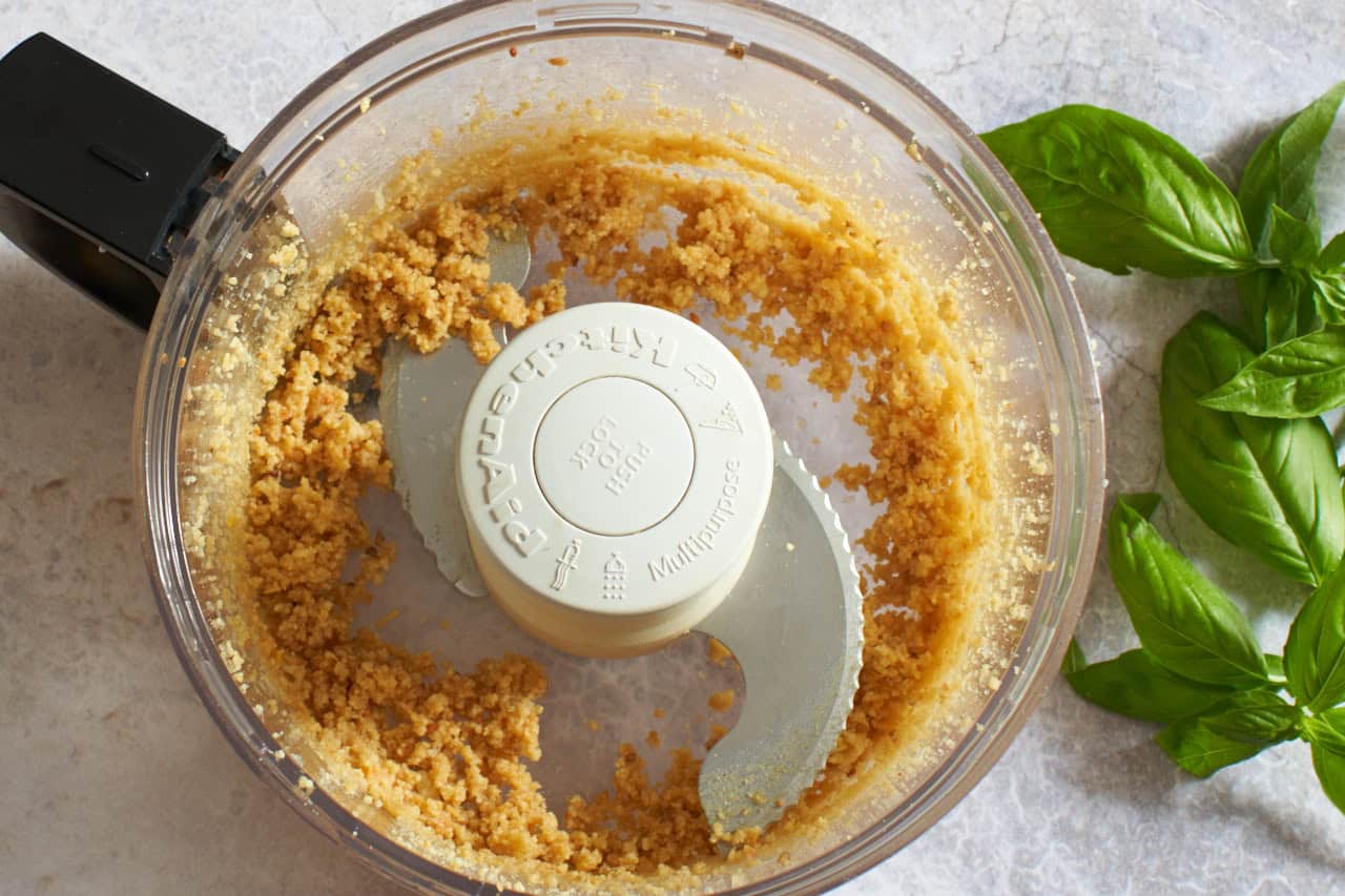 Ground pine nuts in a food processor.