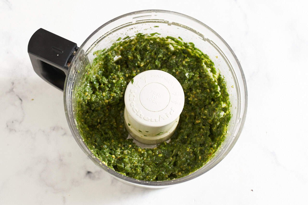 Finished pistachio pesto in a food processor.