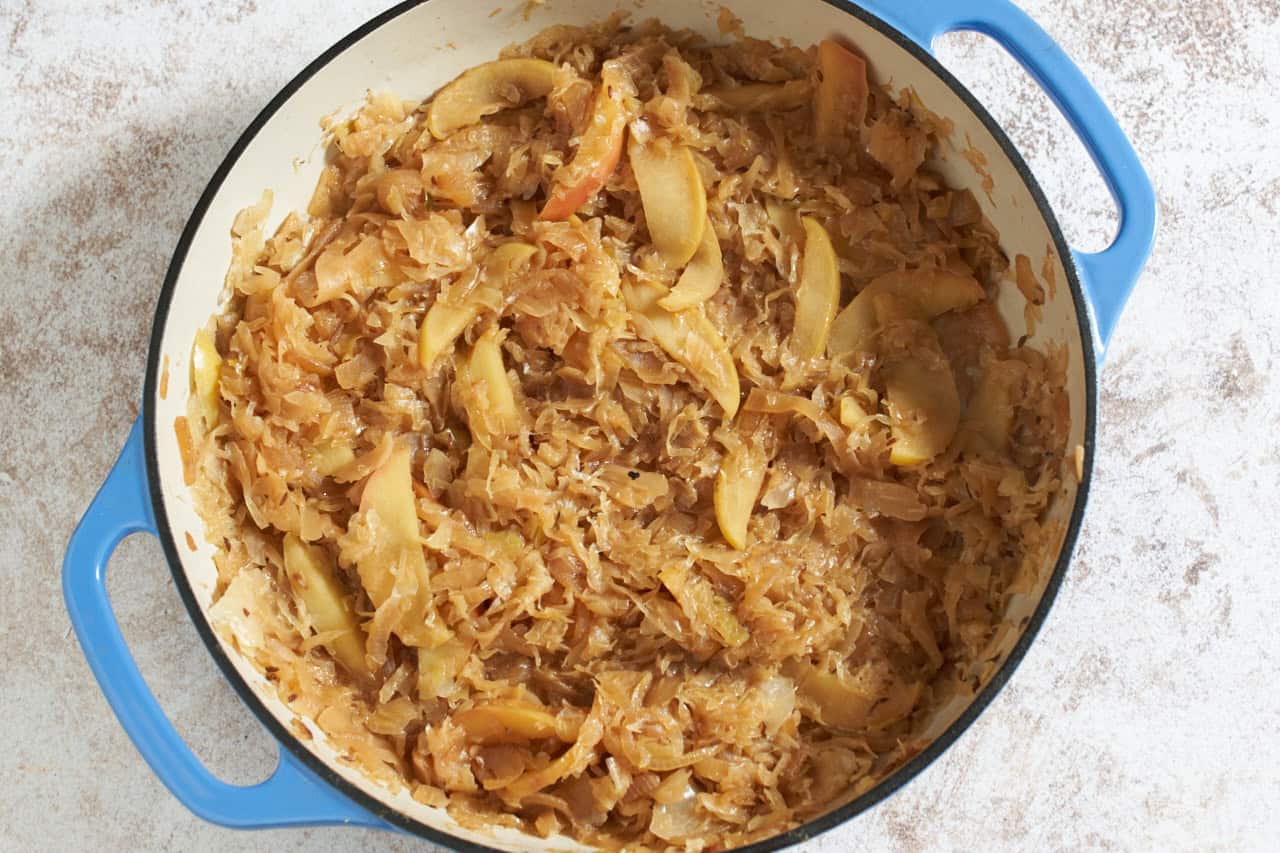 Sauerkraut, apples and onion that has been cooked down in a skillet.